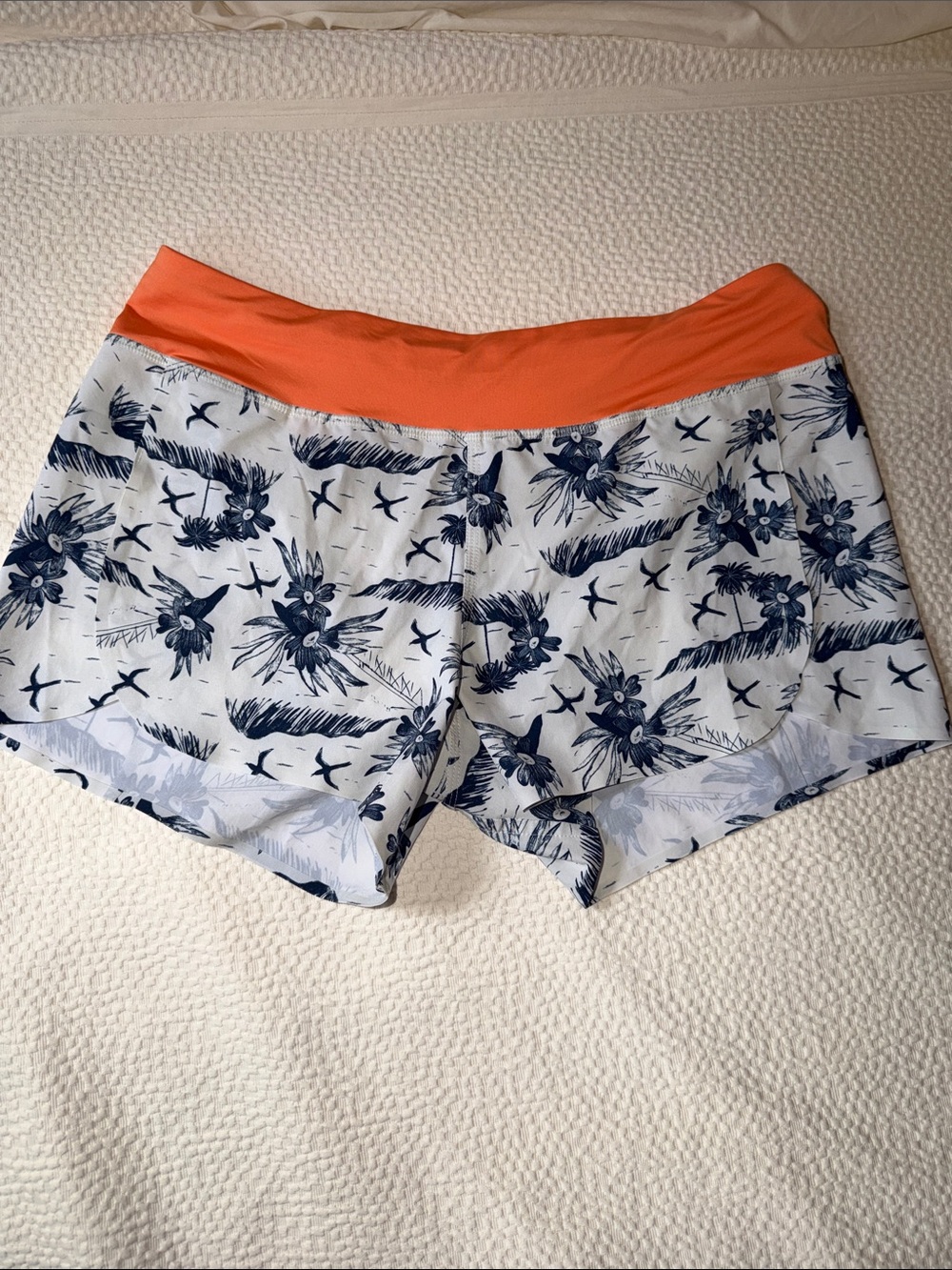 Patagonia Women's Navy Floral Athletic Shorts with Orange Waistband